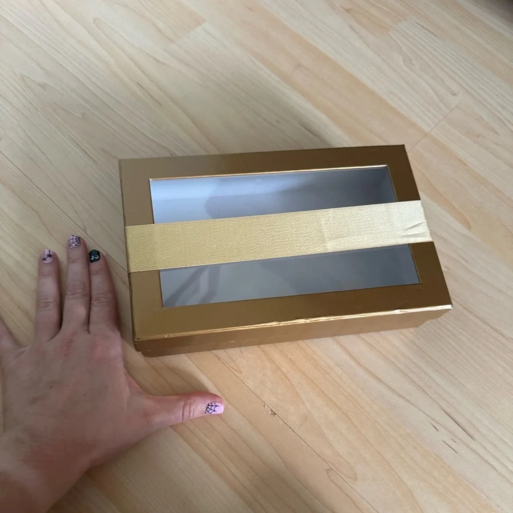 Gold clear lid gift box with banded gold ribbon